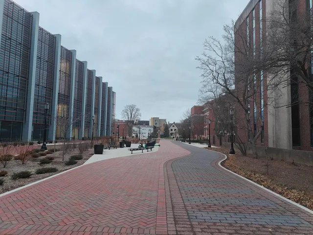 A brick path winding between buildings at Purdue.