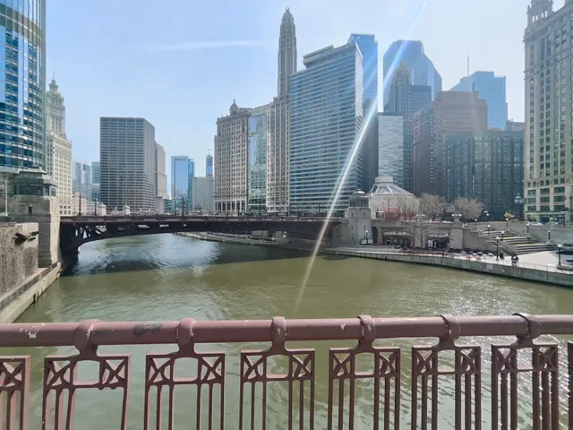 The Chicago River between bridges and tall buildings.